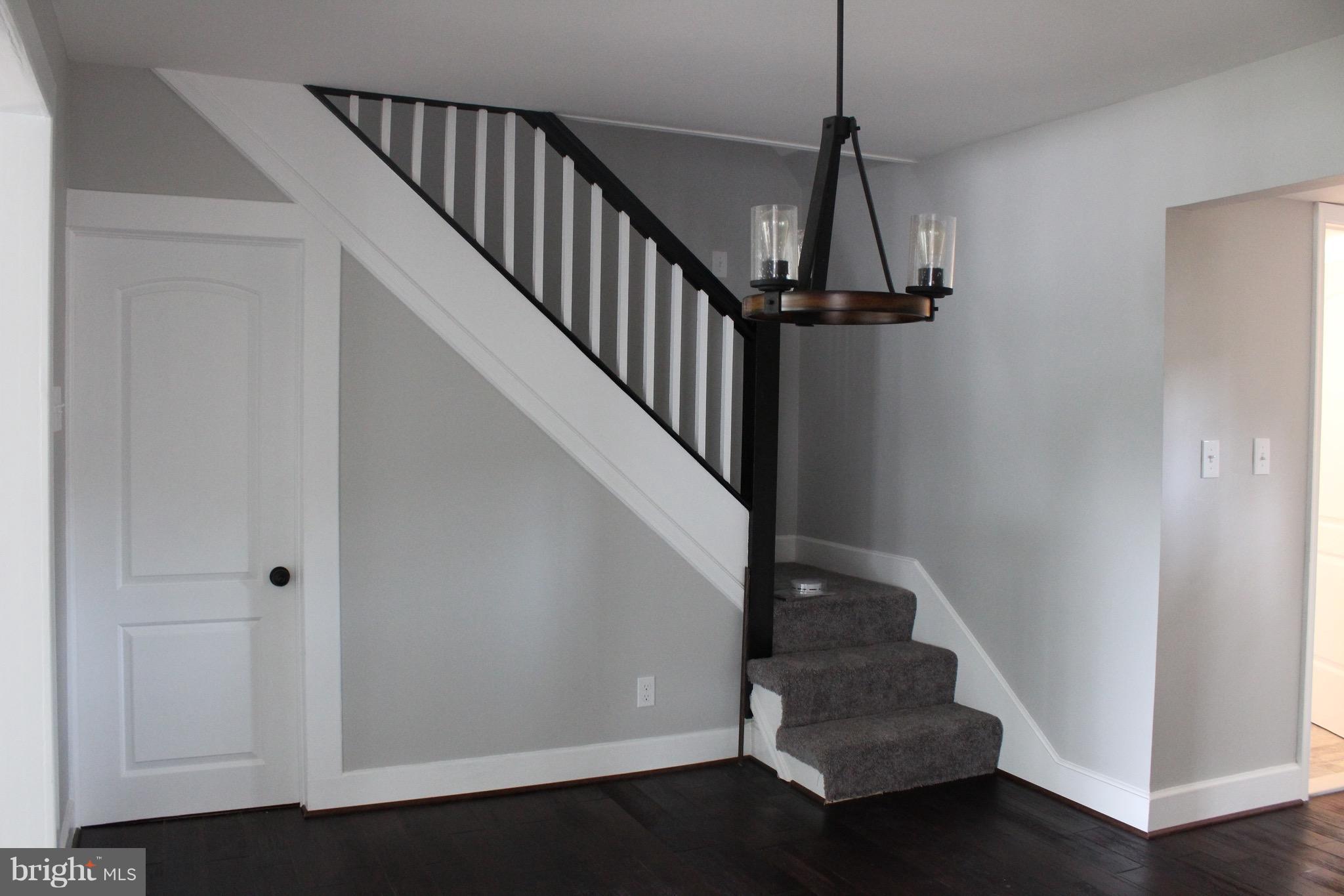 7530 East Battle Grove Road Dundalk, MD 21222 - Photo 8 of 27 a view of entryway and hall with wooden floor