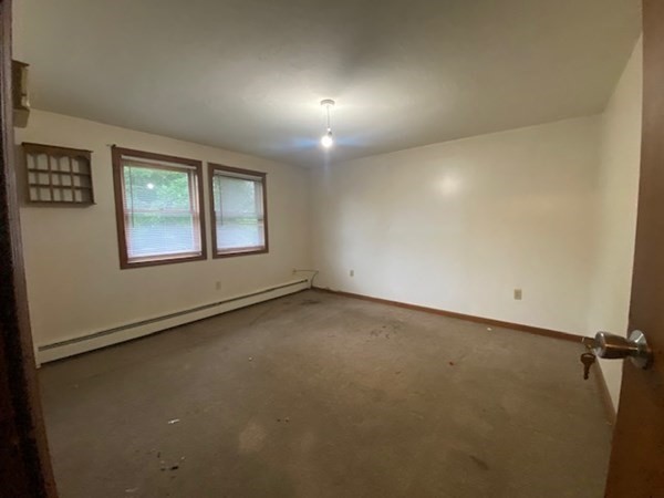 35 Wall Street, Unit D Worcester, MA 01604 - Photo 11 of 12 an empty room with windows and closet