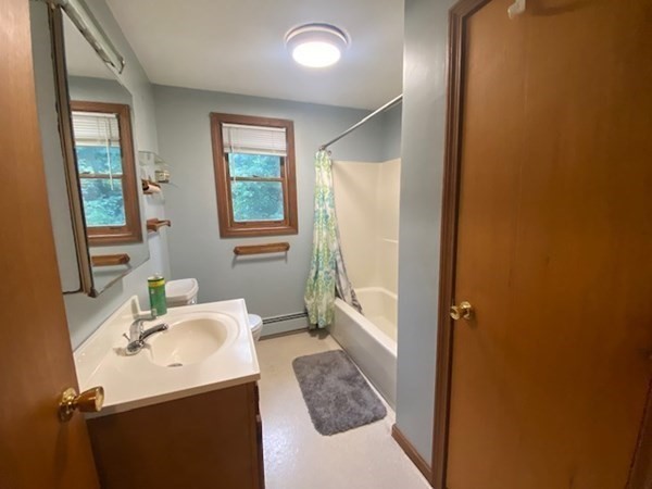 35 Wall Street, Unit D Worcester, MA 01604 - Photo 12 of 12 a bathroom with a sink and a mirror