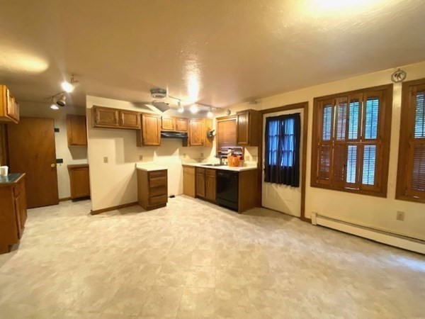 35 Wall Street, Unit D Worcester, MA 01604 - Photo 6 of 12 a living room with stainless steel appliances kitchen island furniture and a kitchen view