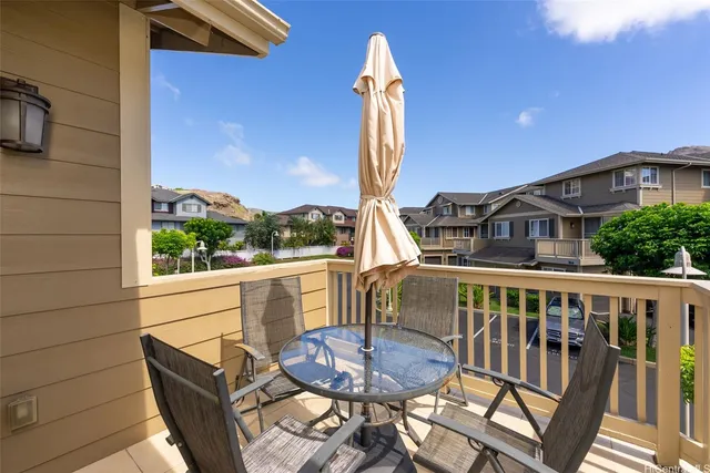 a view of a chair and table in the balcony