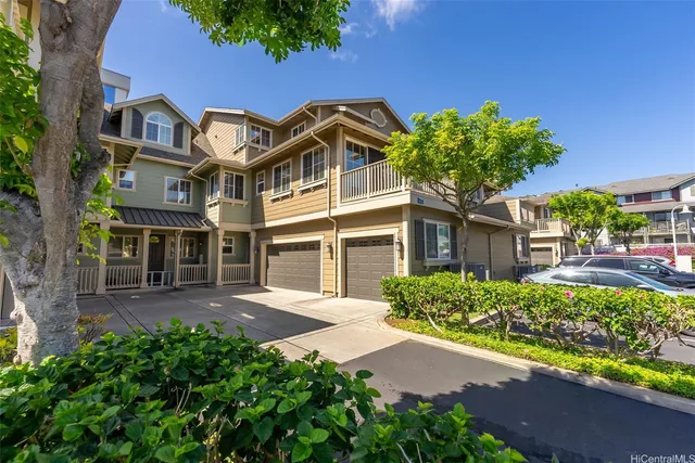 front view of a house with a garden