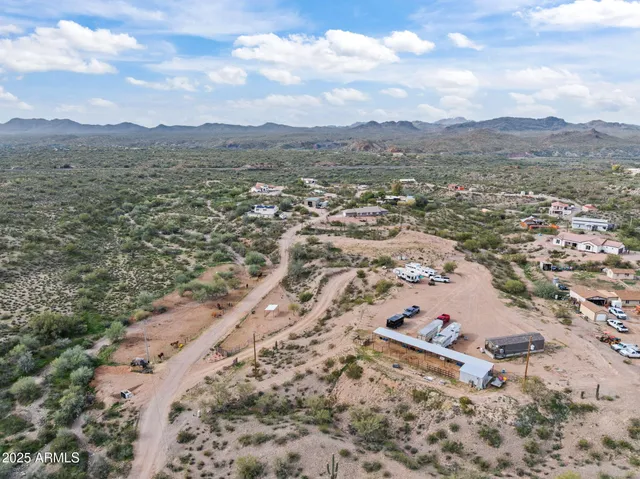an aerial view of a houses with a yard