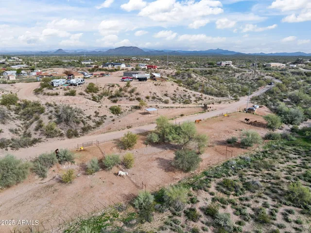 a view of a balcony with chairs and wooden floor