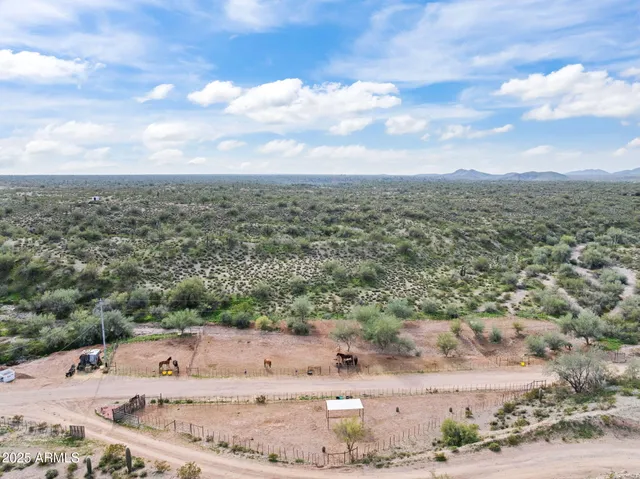a kitchen with stainless steel appliances a refrigerator and a stove top oven