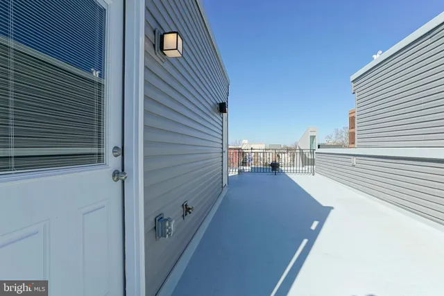 a view of a balcony with seating space