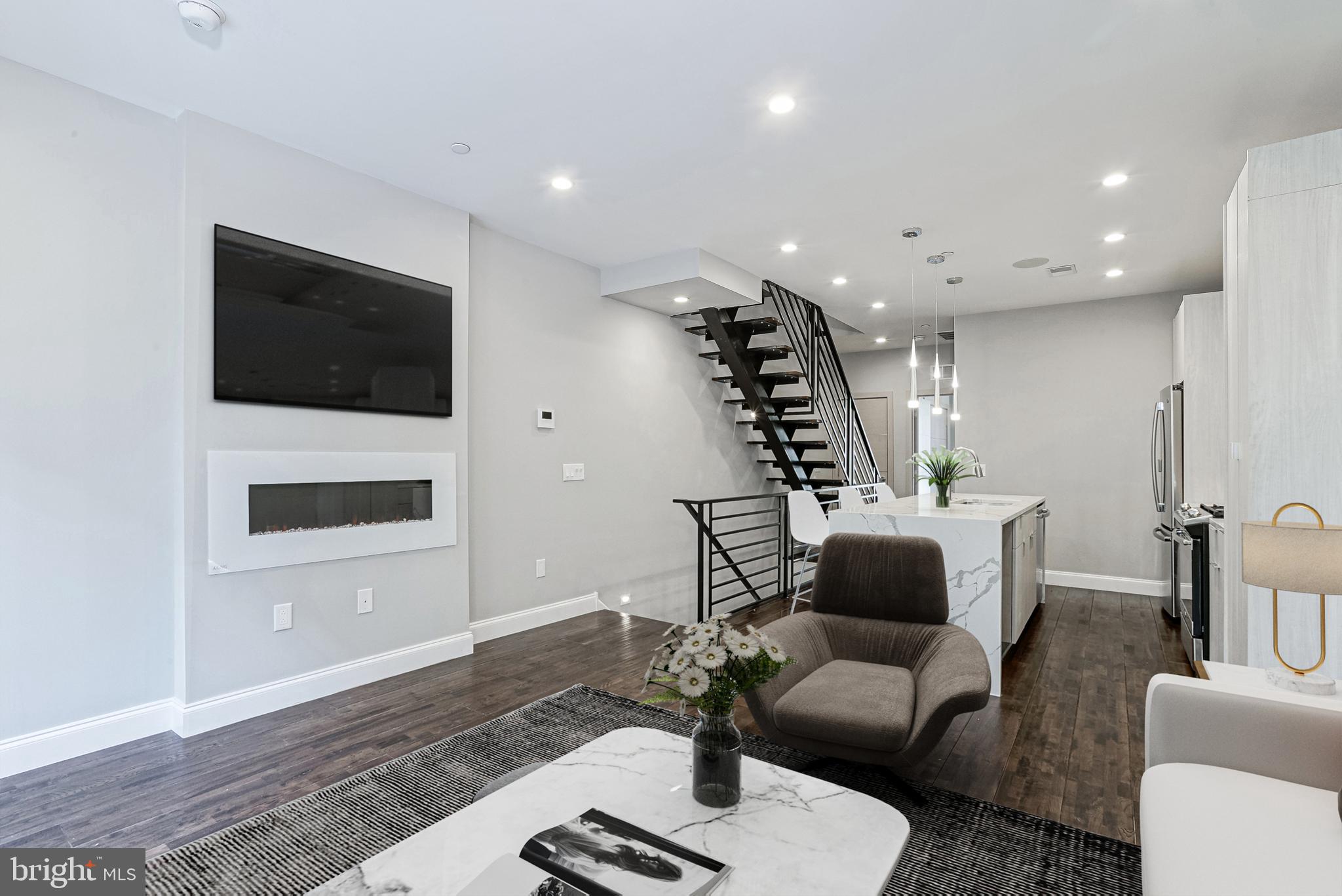 1630 Cambridge Street, Unit B Philadelphia, PA 19130 - Photo 2 of 24 a living room with furniture and a flat screen tv