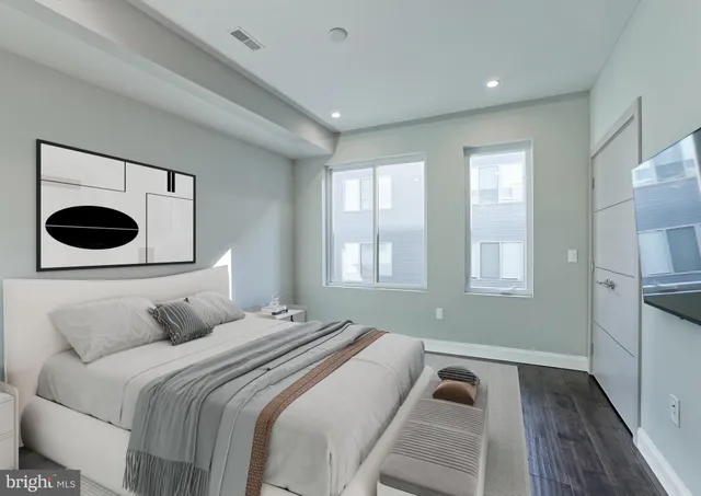 a bedroom with a bed and window