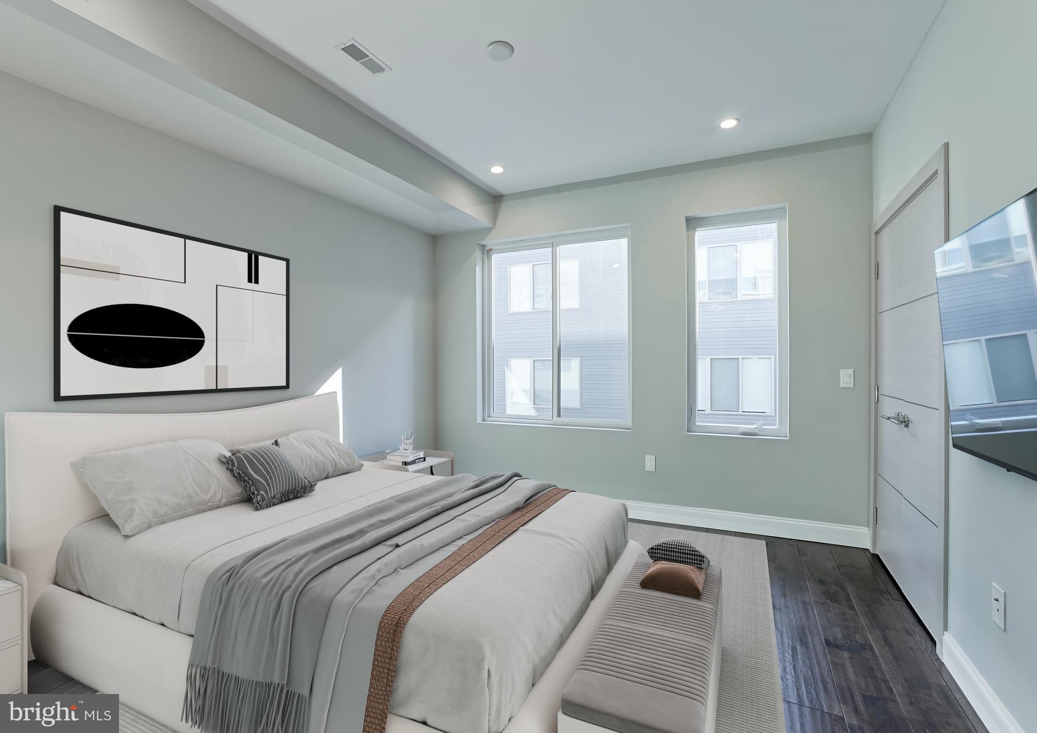 1630 Cambridge Street, Unit B Philadelphia, PA 19130 - Photo 6 of 24 a bedroom with a bed and window