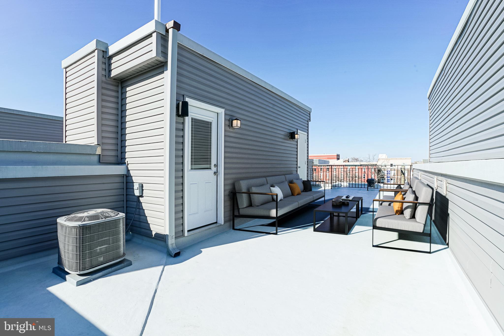 1630 Cambridge Street, Unit B Philadelphia, PA 19130 - Photo 9 of 24 a view of a patio with table and chairs a barbeque