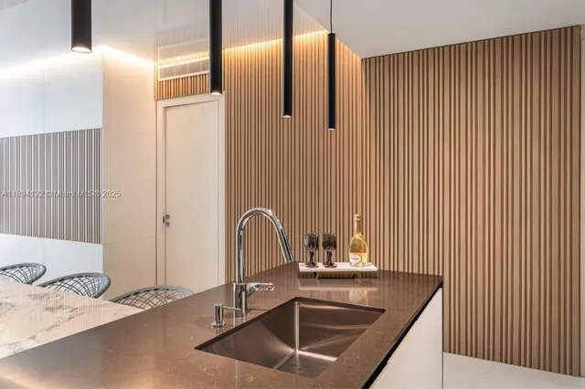 a kitchen with a table and chairs in it