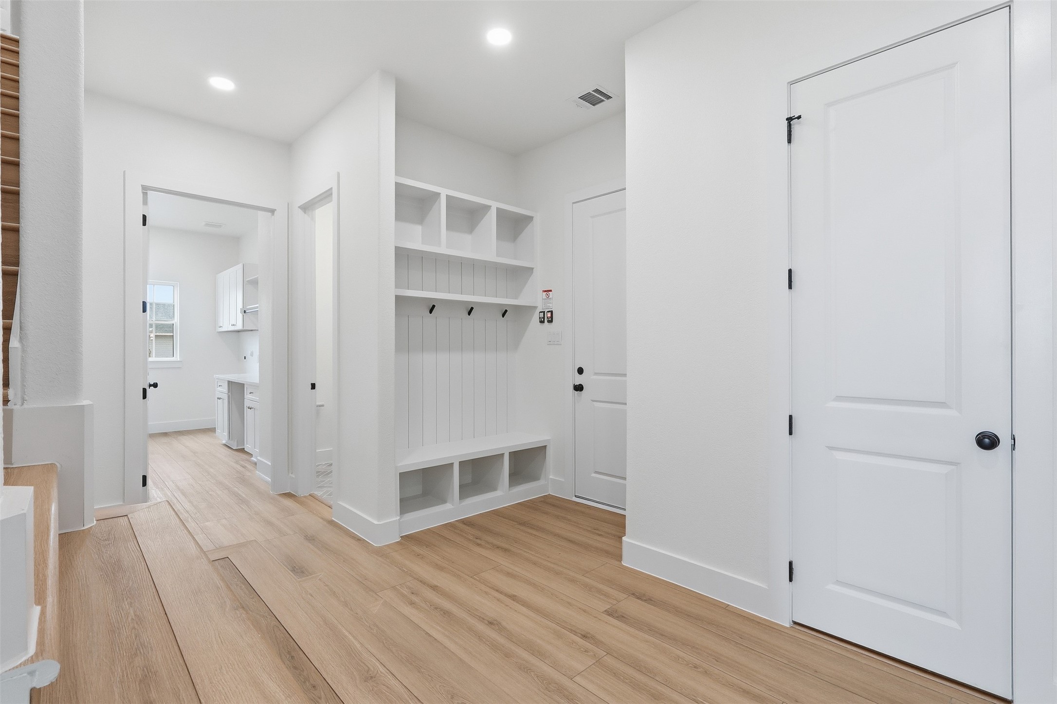 467 Springfield Drive Angleton, TX 77515 - Photo 14 of 42 a view of a hallway with wooden floor