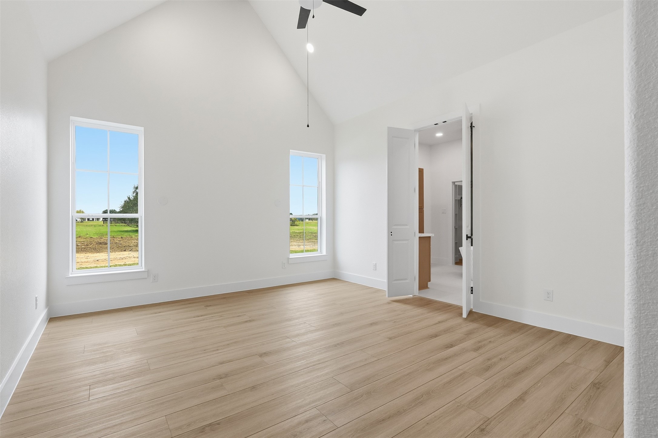 467 Springfield Drive Angleton, TX 77515 - Photo 15 of 42 an empty room with wooden floor and windows