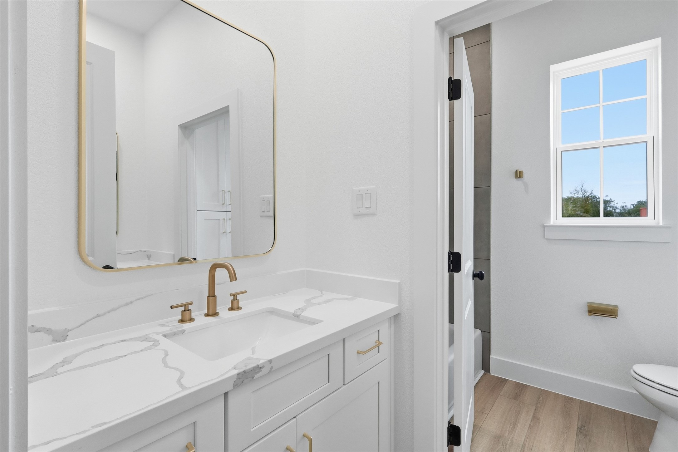 467 Springfield Drive Angleton, TX 77515 - Photo 29 of 42 a bathroom with a sink and a toilet