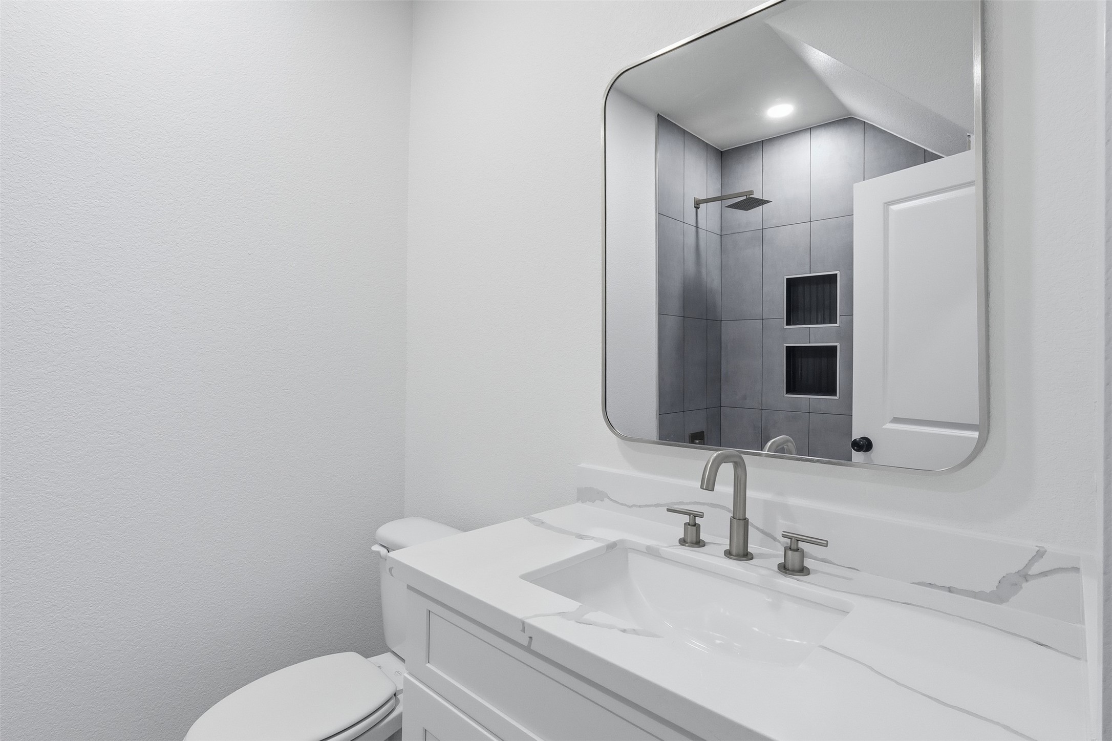 467 Springfield Drive Angleton, TX 77515 - Photo 33 of 42 a bathroom with a sink toilet and mirror