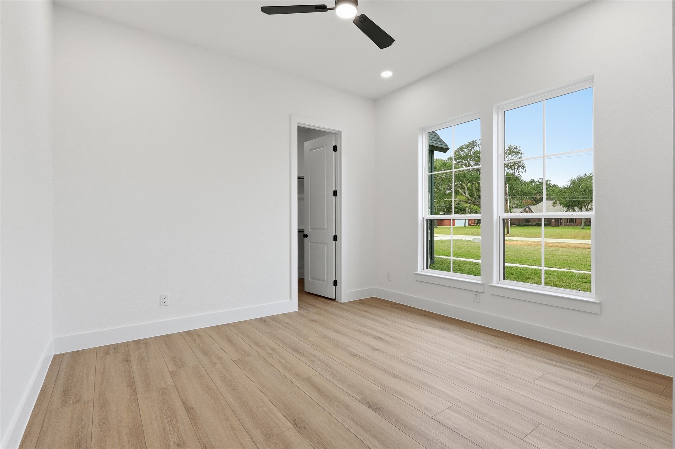 467 Springfield Drive Angleton, TX 77515 - Photo 35 of 42 wooden floor in an empty room with a window