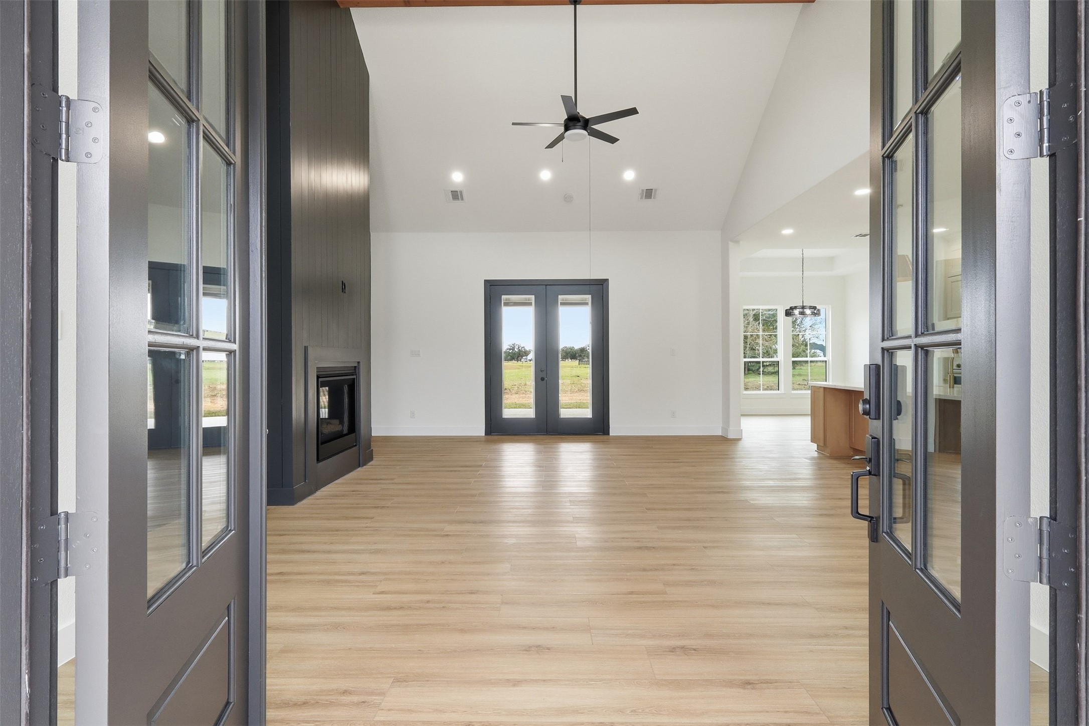 467 Springfield Drive Angleton, TX 77515 - Photo 4 of 42 a view of a hallway with wooden floor windows and livingroom view