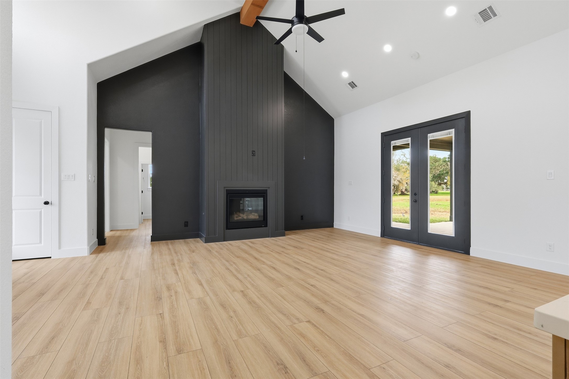467 Springfield Drive Angleton, TX 77515 - Photo 6 of 42 a view of an empty room with wooden floor and a window