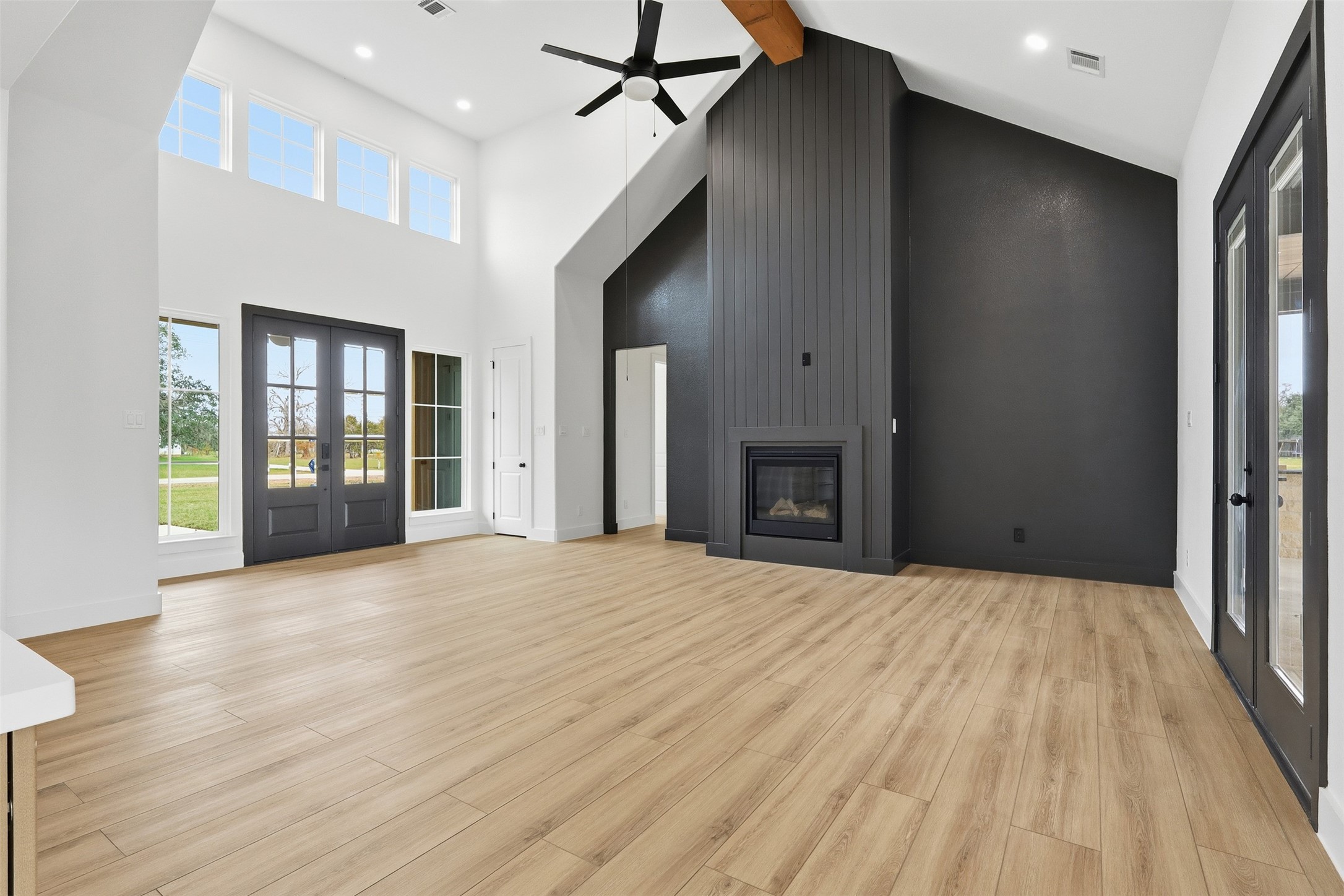 467 Springfield Drive Angleton, TX 77515 - Photo 7 of 42 a view of an empty room with wooden floor and a window