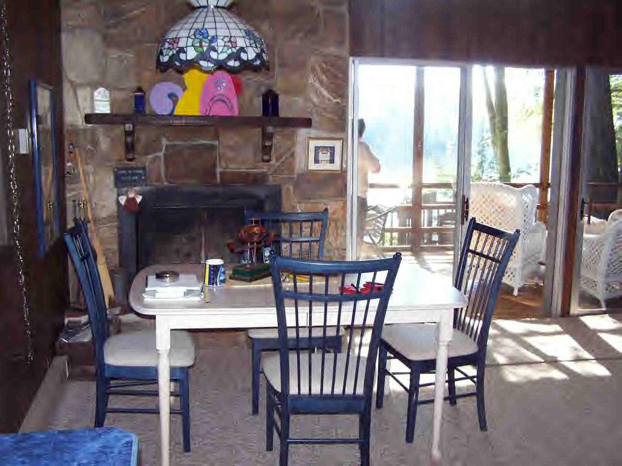 66 Loop Otis, MA 01253 - Photo 8 of 19 a view of a dining room with furniture a chandelier and wooden floor