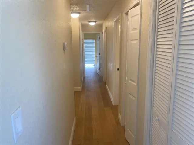 a bathroom with a granite countertop toilet and a sink