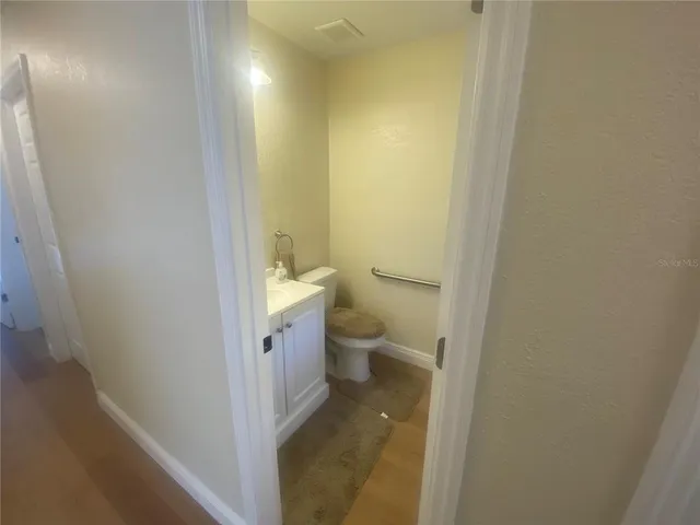 a view of an empty room with a fan