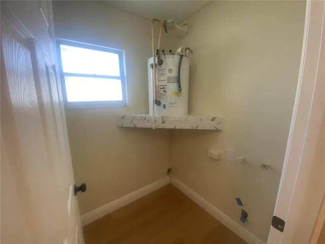 a bath room with a sink and a toilet
