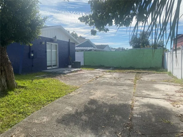 a view of backyard with green space