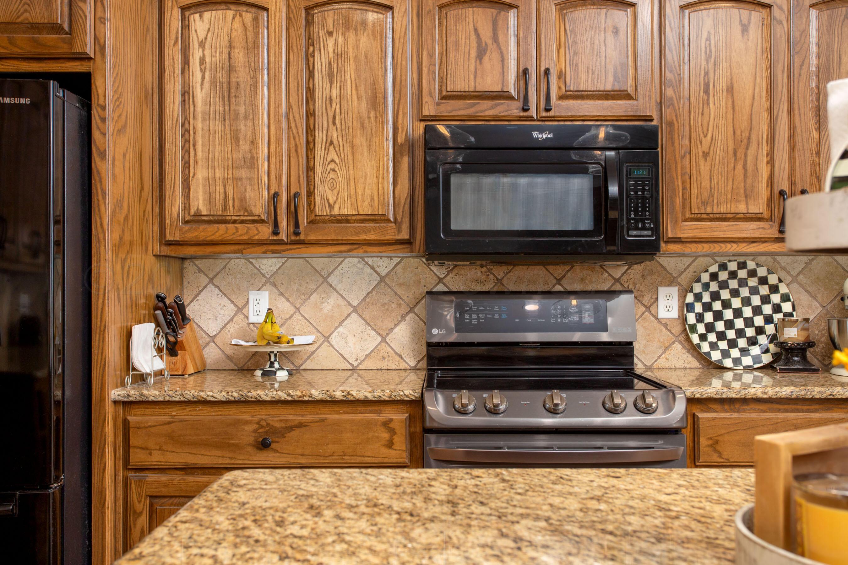 18500 Morning Star Road Bushland, TX 79124 - Photo 14 of 47 a stove top oven sitting inside of a kitchen