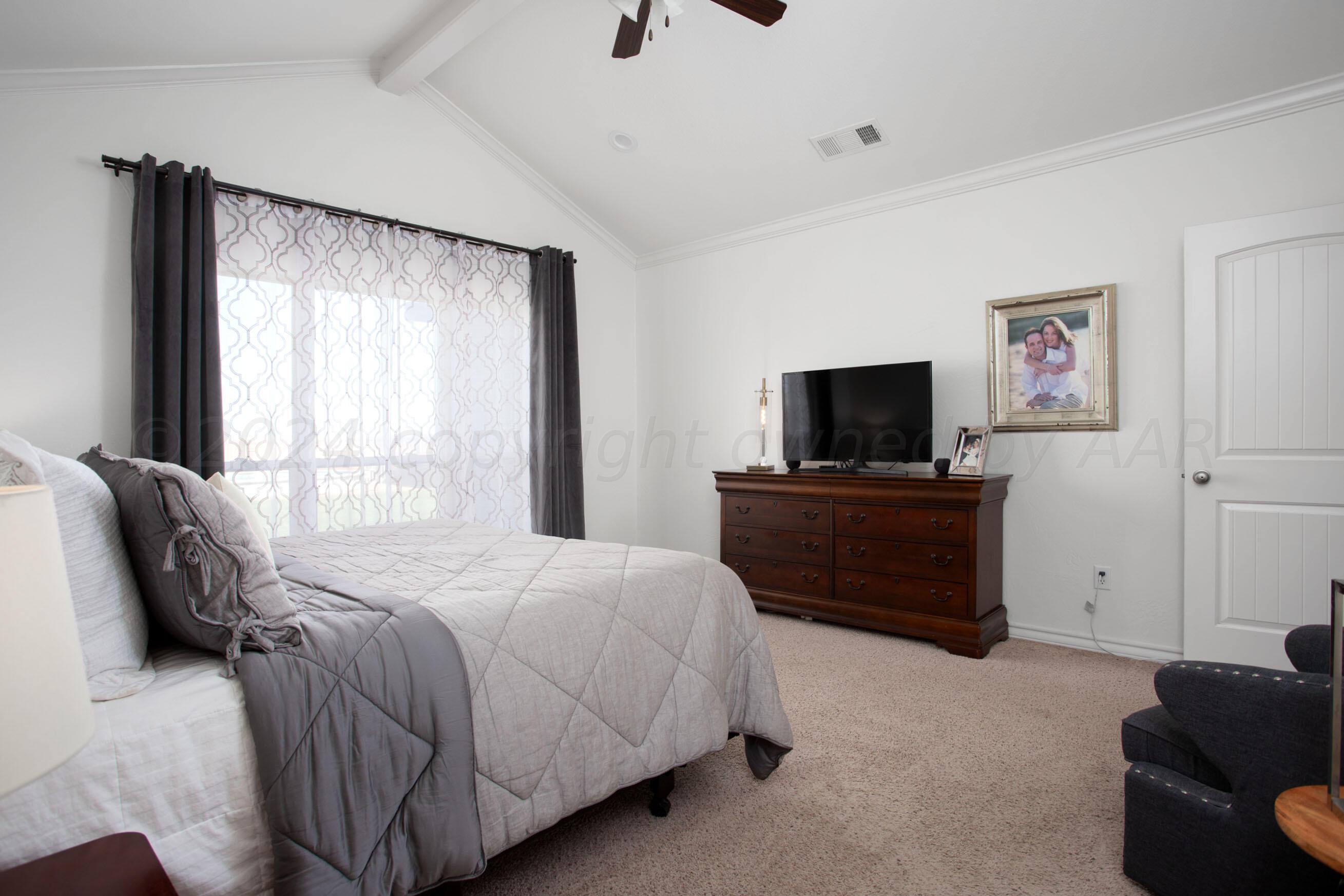 18500 Morning Star Road Bushland, TX 79124 - Photo 20 of 47 a bedroom with a bed and a television