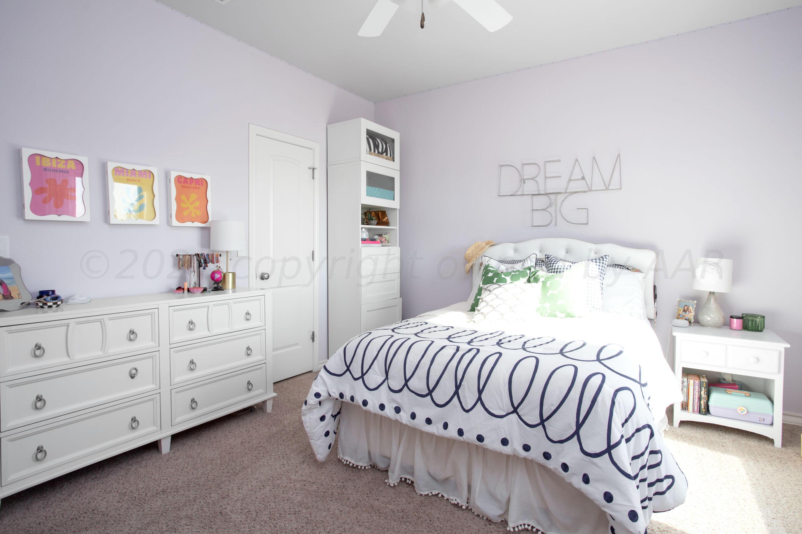 18500 Morning Star Road Bushland, TX 79124 - Photo 26 of 47 a bedroom with a bed and a dresser in it