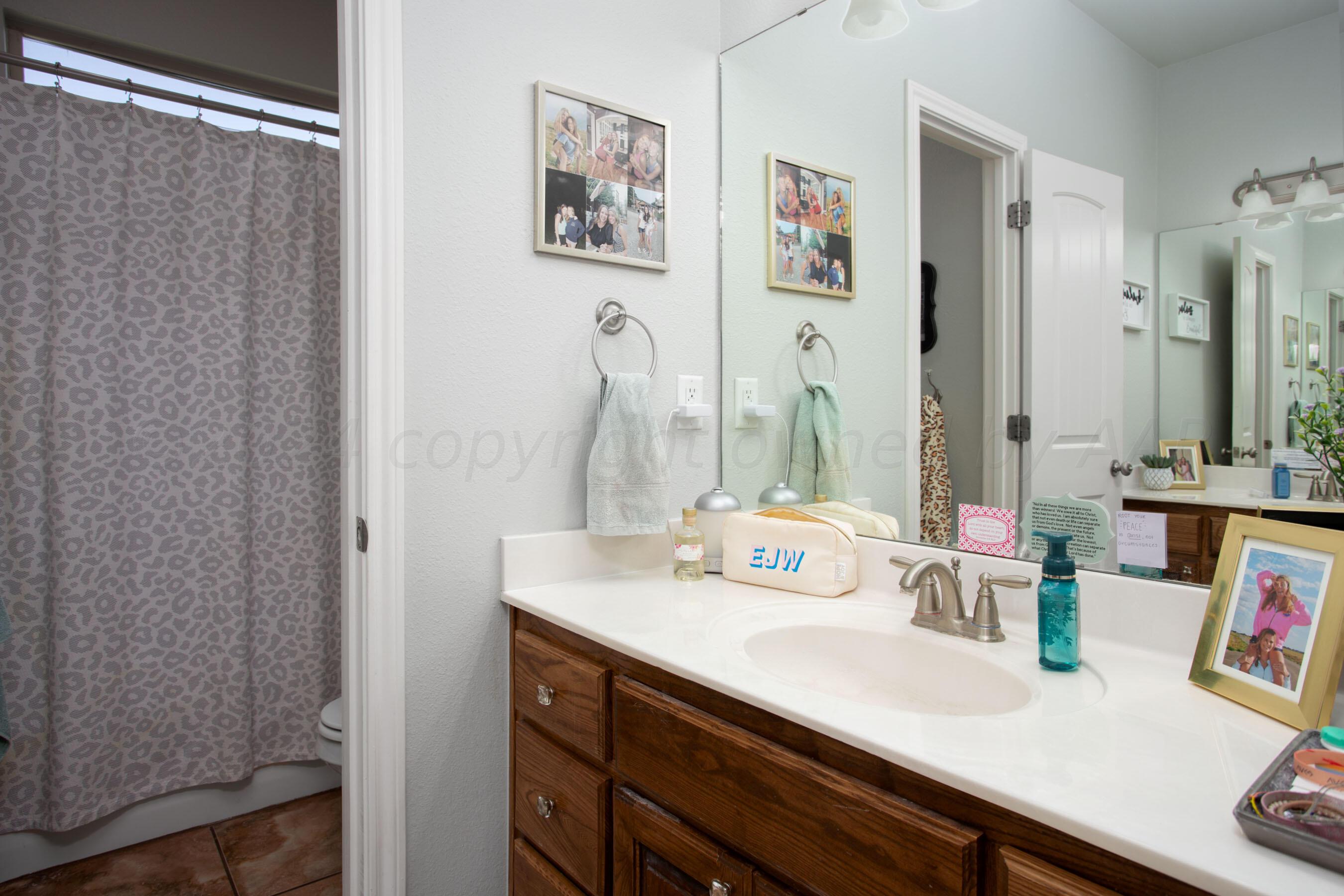 18500 Morning Star Road Bushland, TX 79124 - Photo 28 of 47 a bathroom with a sink and a mirror