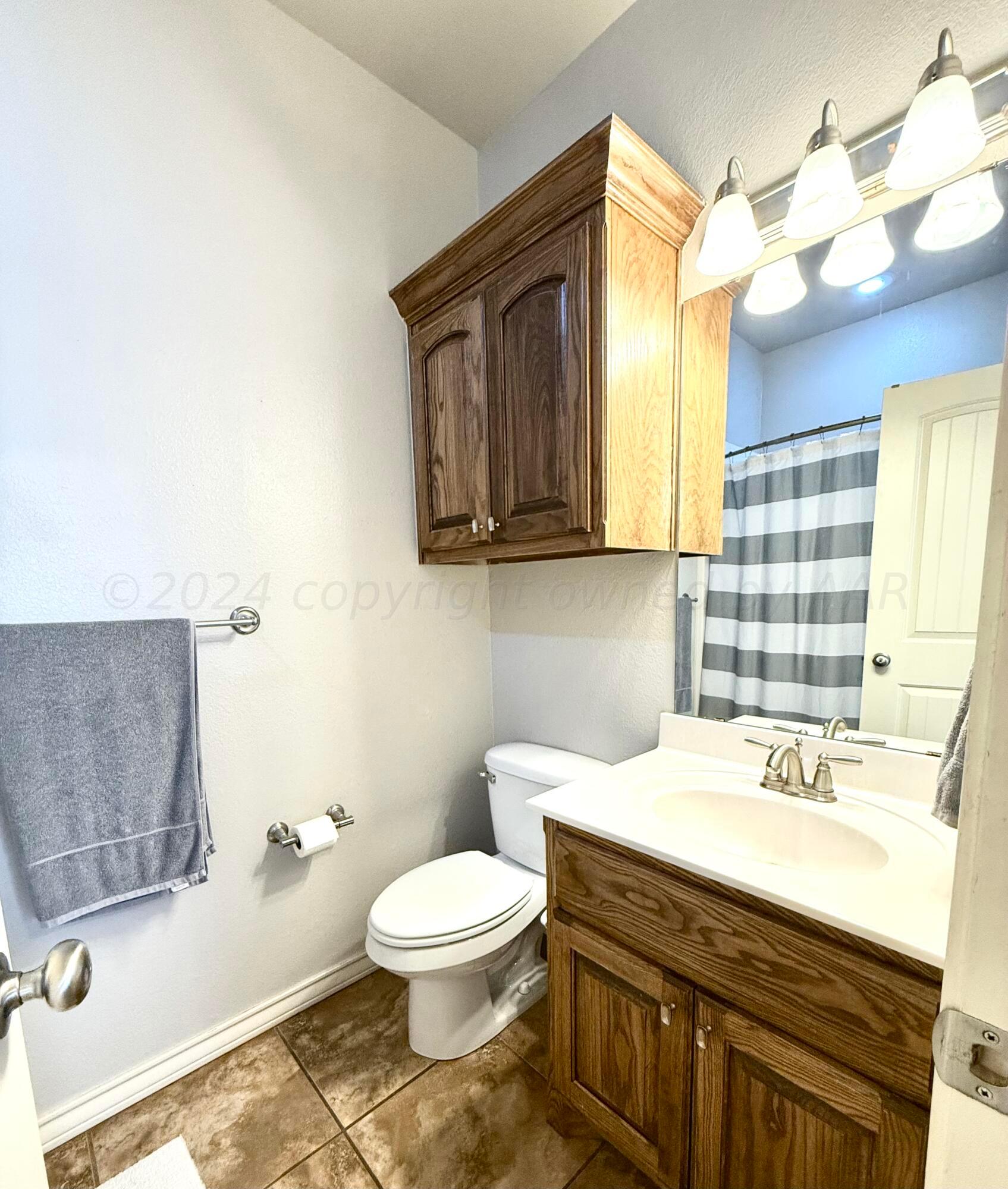 18500 Morning Star Road Bushland, TX 79124 - Photo 34 of 47 a bathroom with a sink a toilet and bathtub