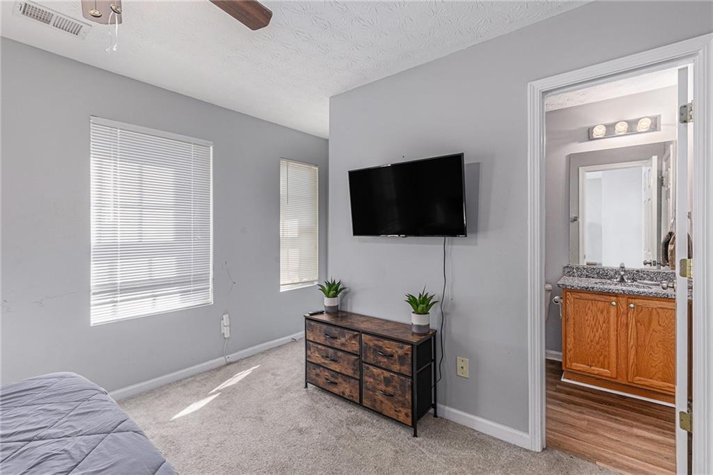 6536 Arbor Gate Drive Southwest, Unit 2 Mableton, GA 30126 - Photo 23 of 27 a living room with furniture and a flat screen tv