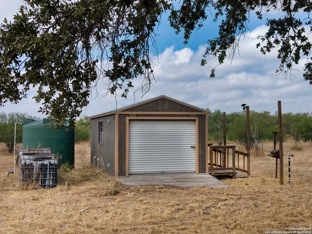 a view of a chair and table in the patio