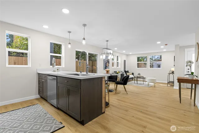a kitchen with lots of counter top space and living room