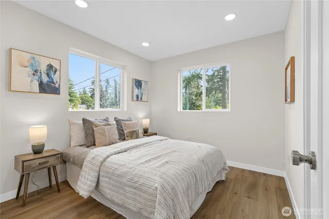 a bedroom with a bed and a lamp