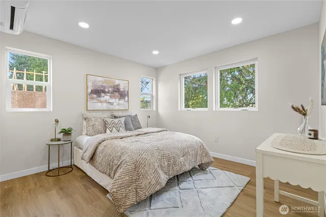 a bedroom with a bed and a table