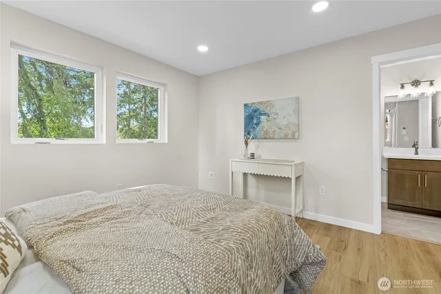 a bedroom with a bed and a fireplace