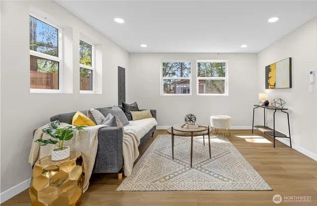 a living room with furniture and a table