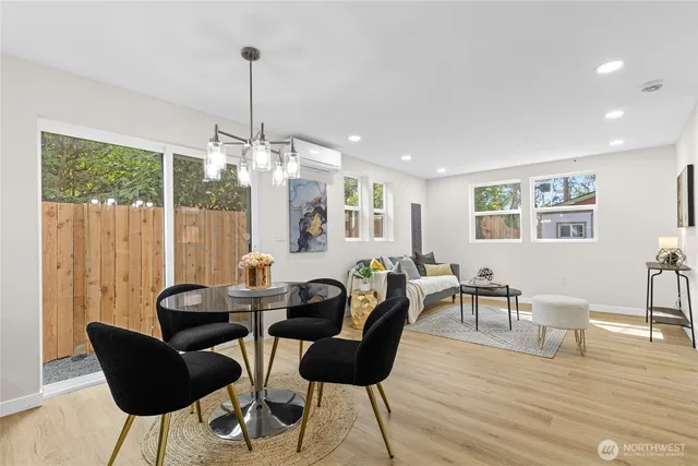 a view of a dining room with furniture window and wooden floor