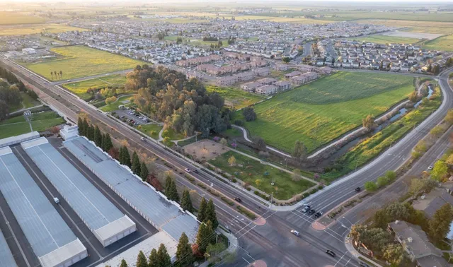 a view of a yard with a terrace