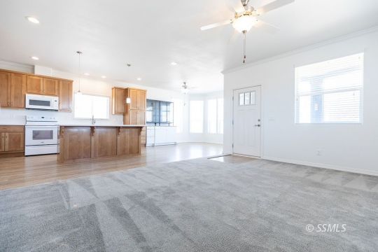 2014 South Brady Street Ridgecrest, CA 93555 - Photo 11 of 32 an empty room with kitchen and window