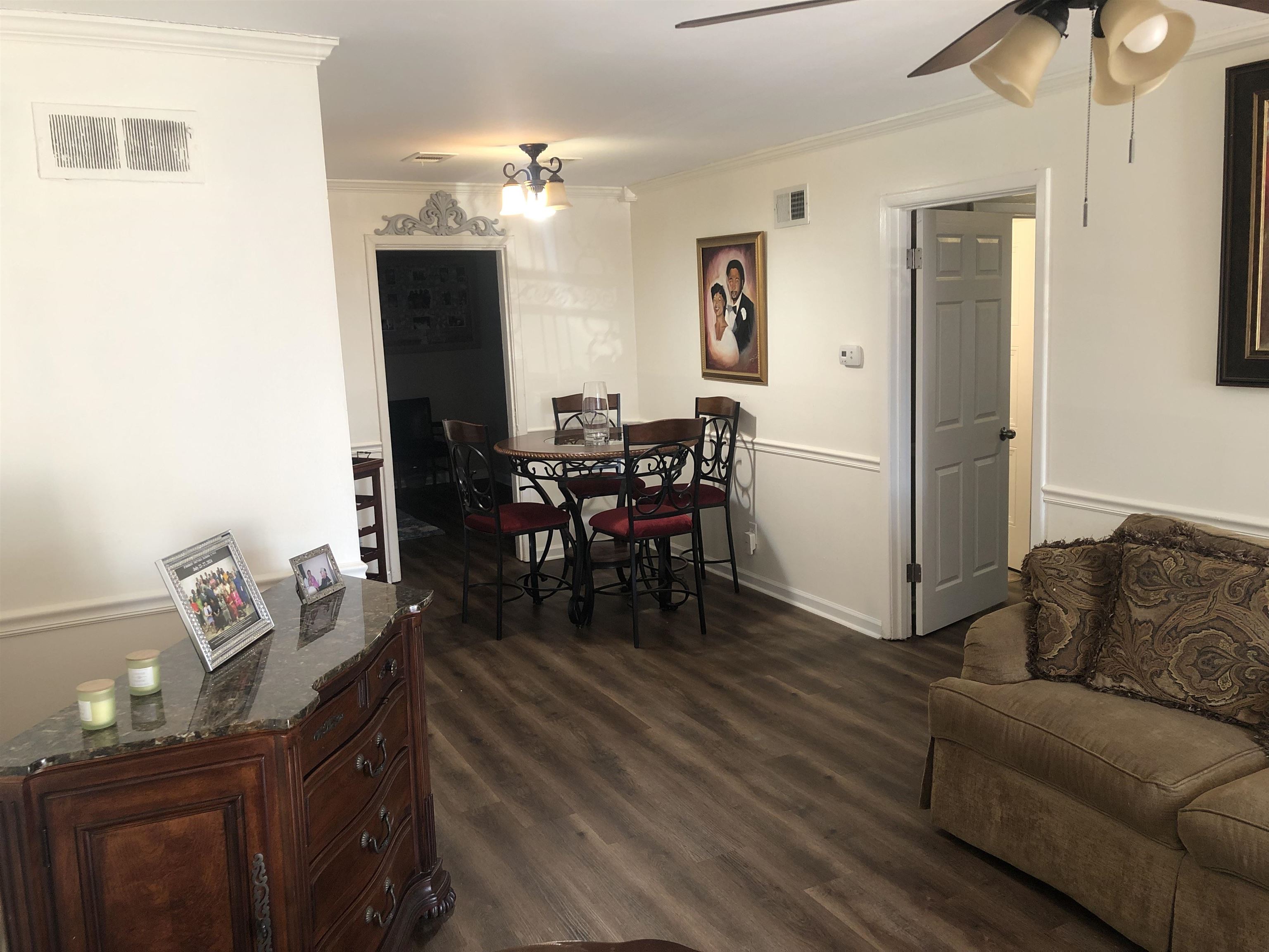 1563 Railton Road Memphis, TN 38111 - Photo 3 of 17 Living area with crown molding, dark wood finished floors, and ceiling fan
