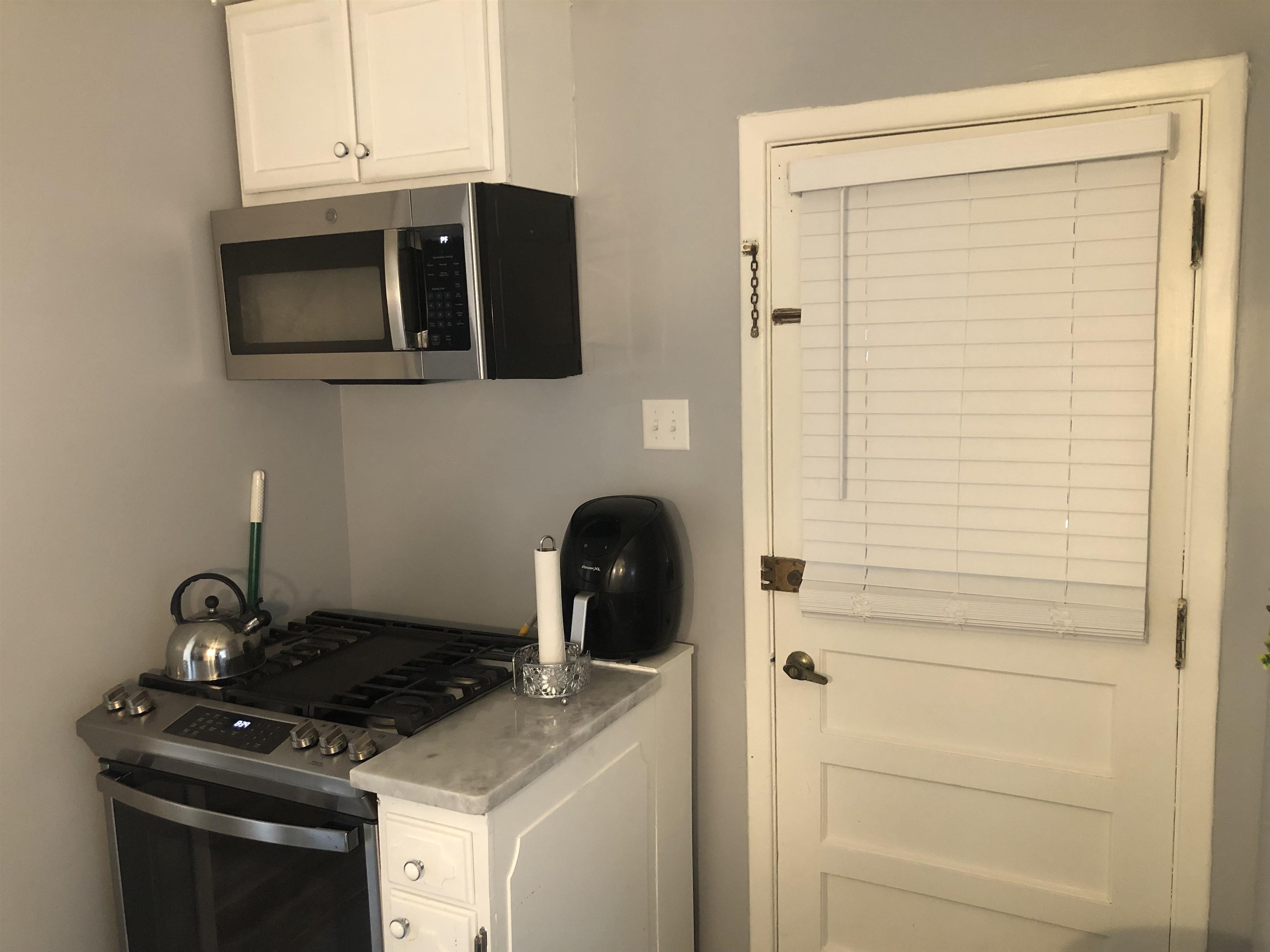 1563 Railton Road Memphis, TN 38111 - Photo 6 of 17 Kitchen featuring stainless steel appliances and white cabinetry