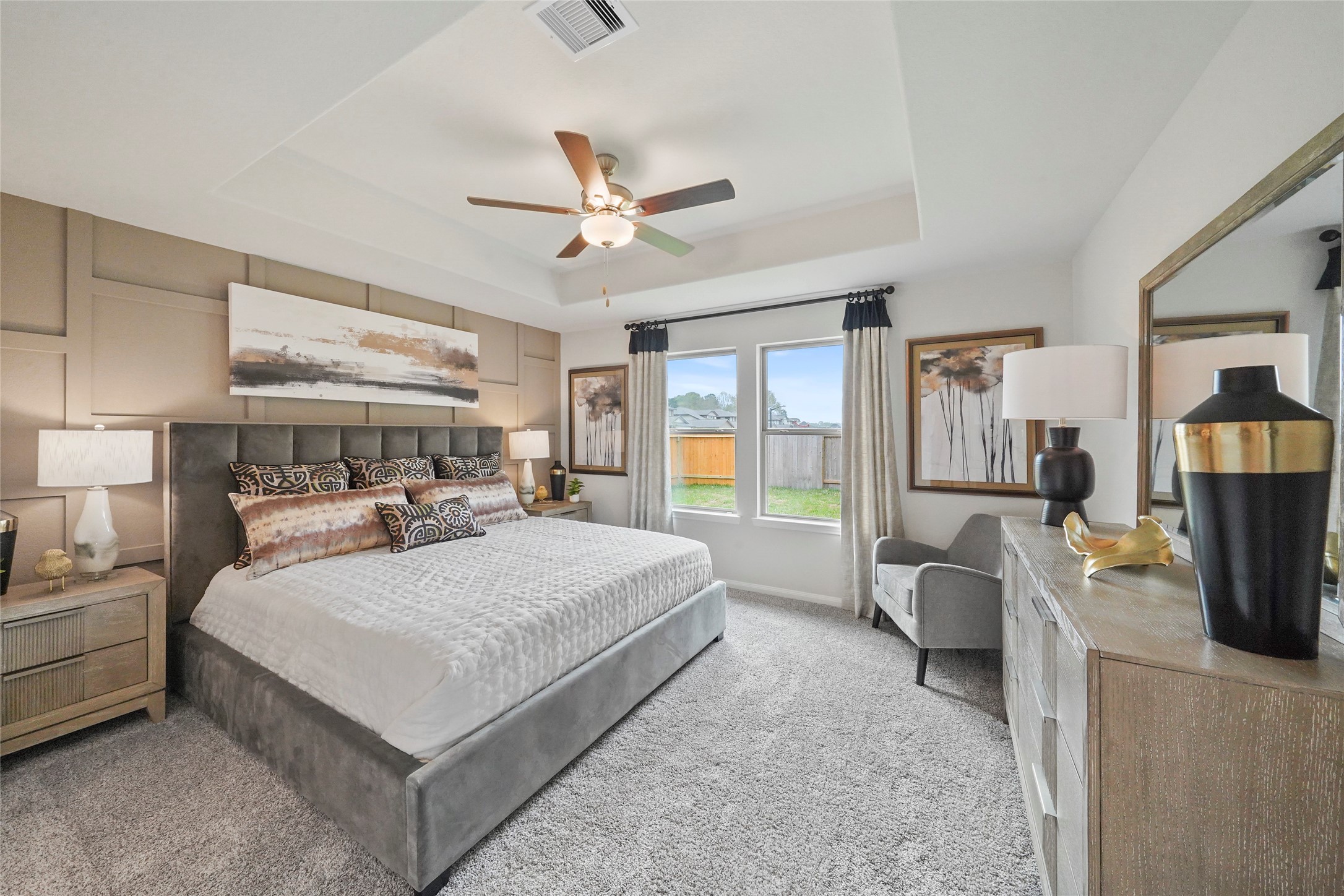 18782 Lucas Michael Way New Caney, TX 77357 - Photo 11 of 16 a living room with a bed furniture flat screen tv and a large window