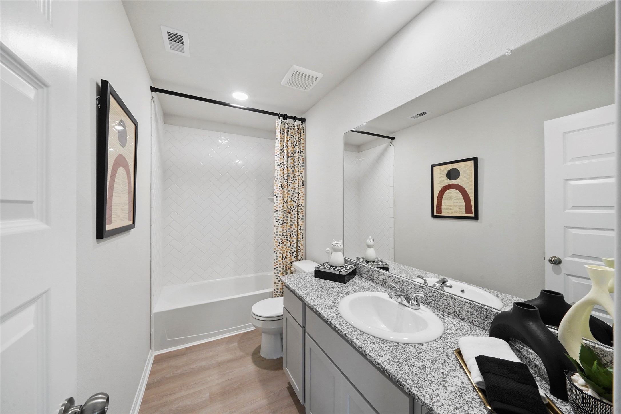 18782 Lucas Michael Way New Caney, TX 77357 - Photo 16 of 16 a bathroom with a granite countertop sink toilet and shower