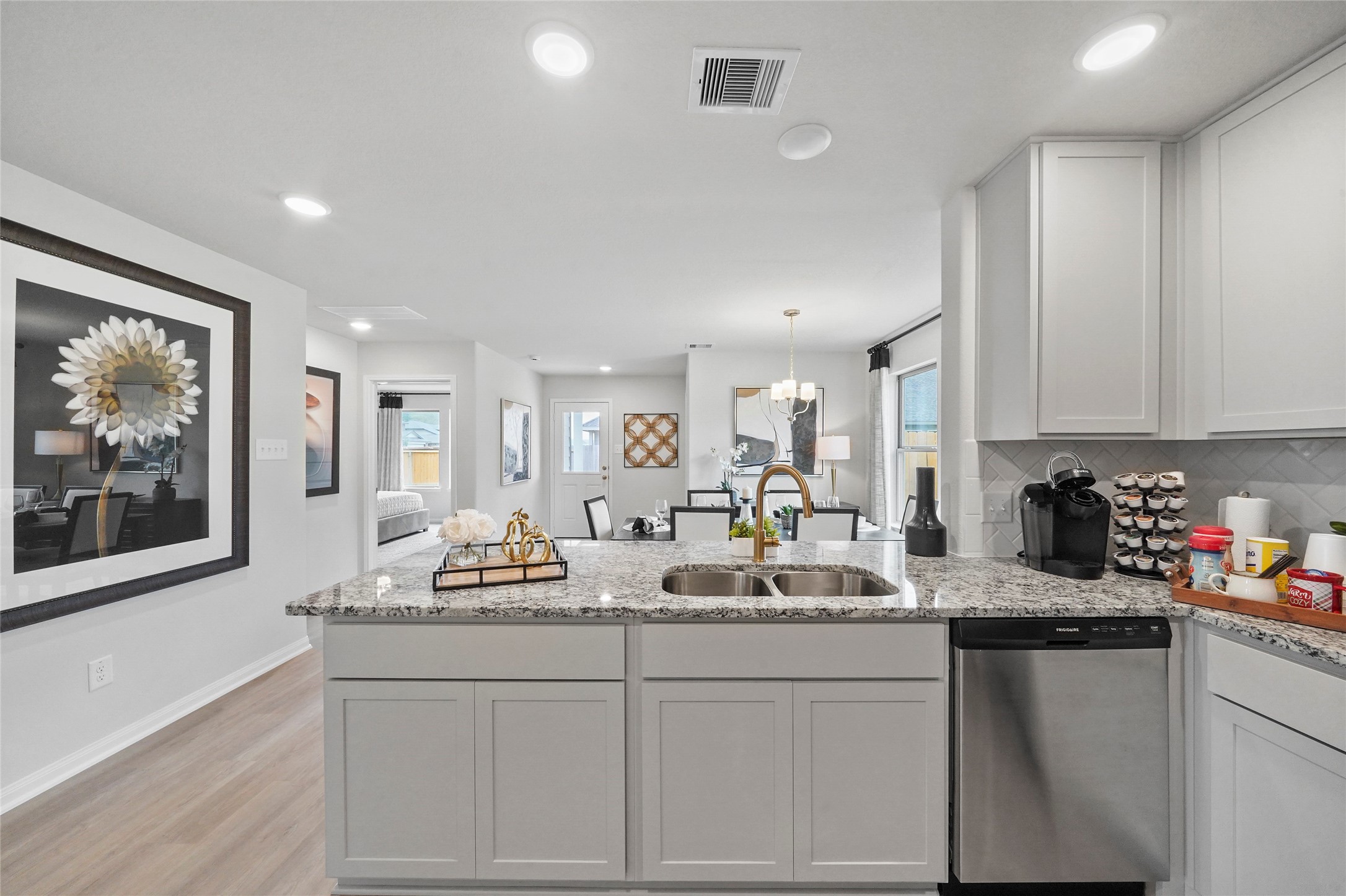 18782 Lucas Michael Way New Caney, TX 77357 - Photo 7 of 16 a kitchen with sink cabinets and window
