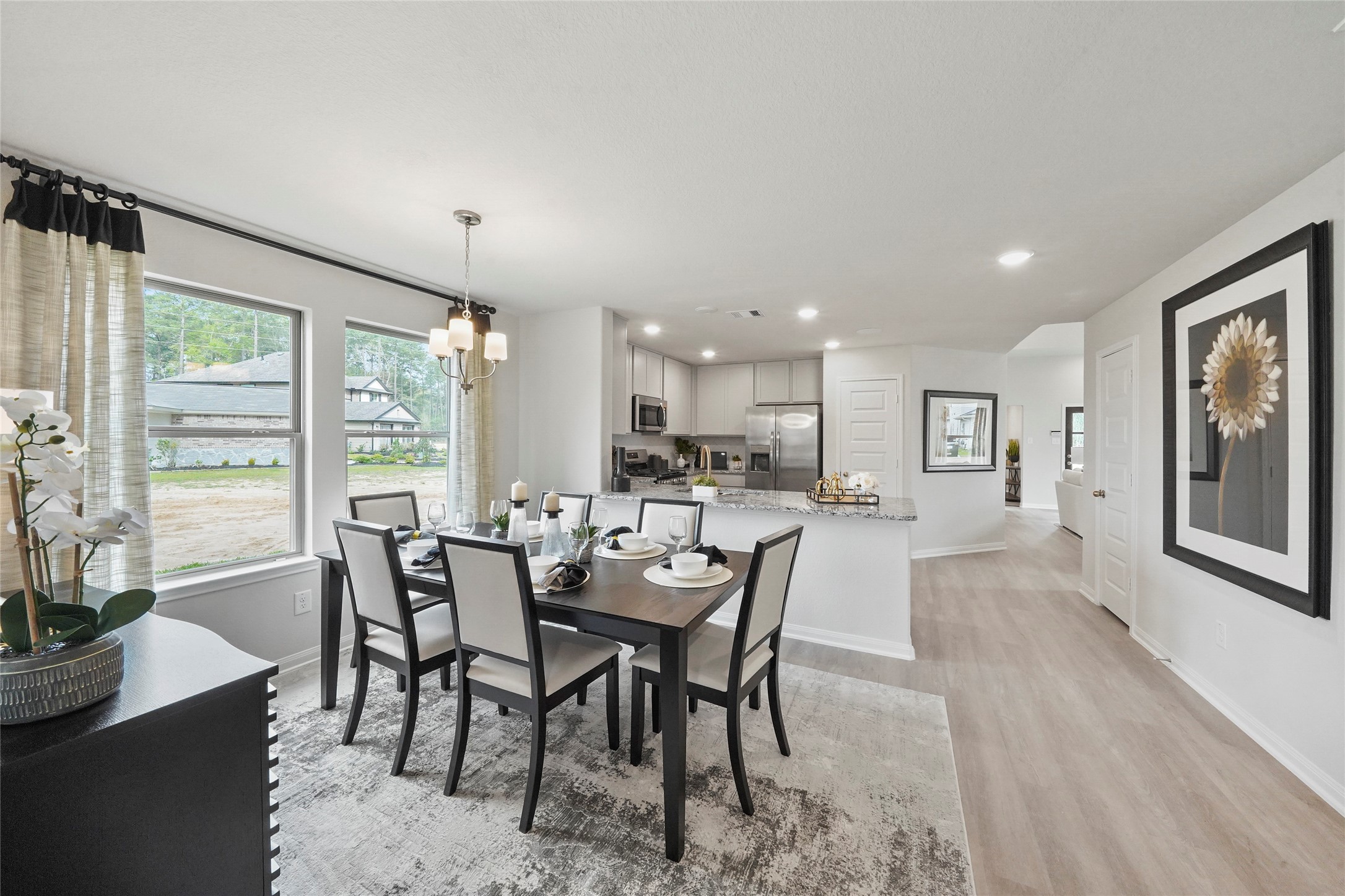 18782 Lucas Michael Way New Caney, TX 77357 - Photo 10 of 16 a view of a dining room with furniture window and outside view