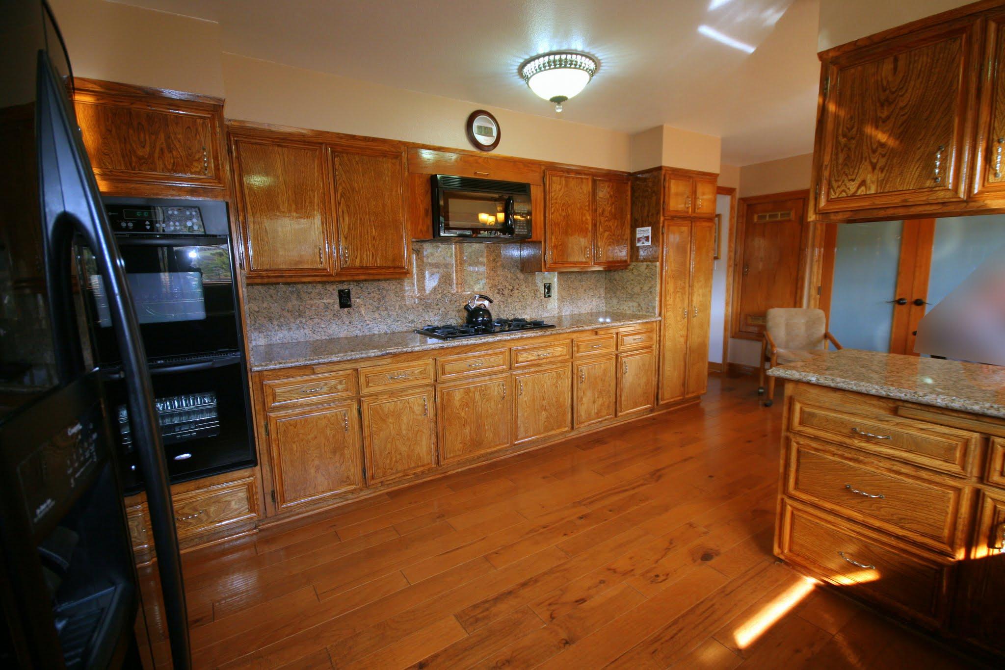 34421 Red Rover Mine Road Acton, CA 93510 - Photo 19 of 52 a large kitchen with stainless steel appliances a large counter top a stove and a refrigerator